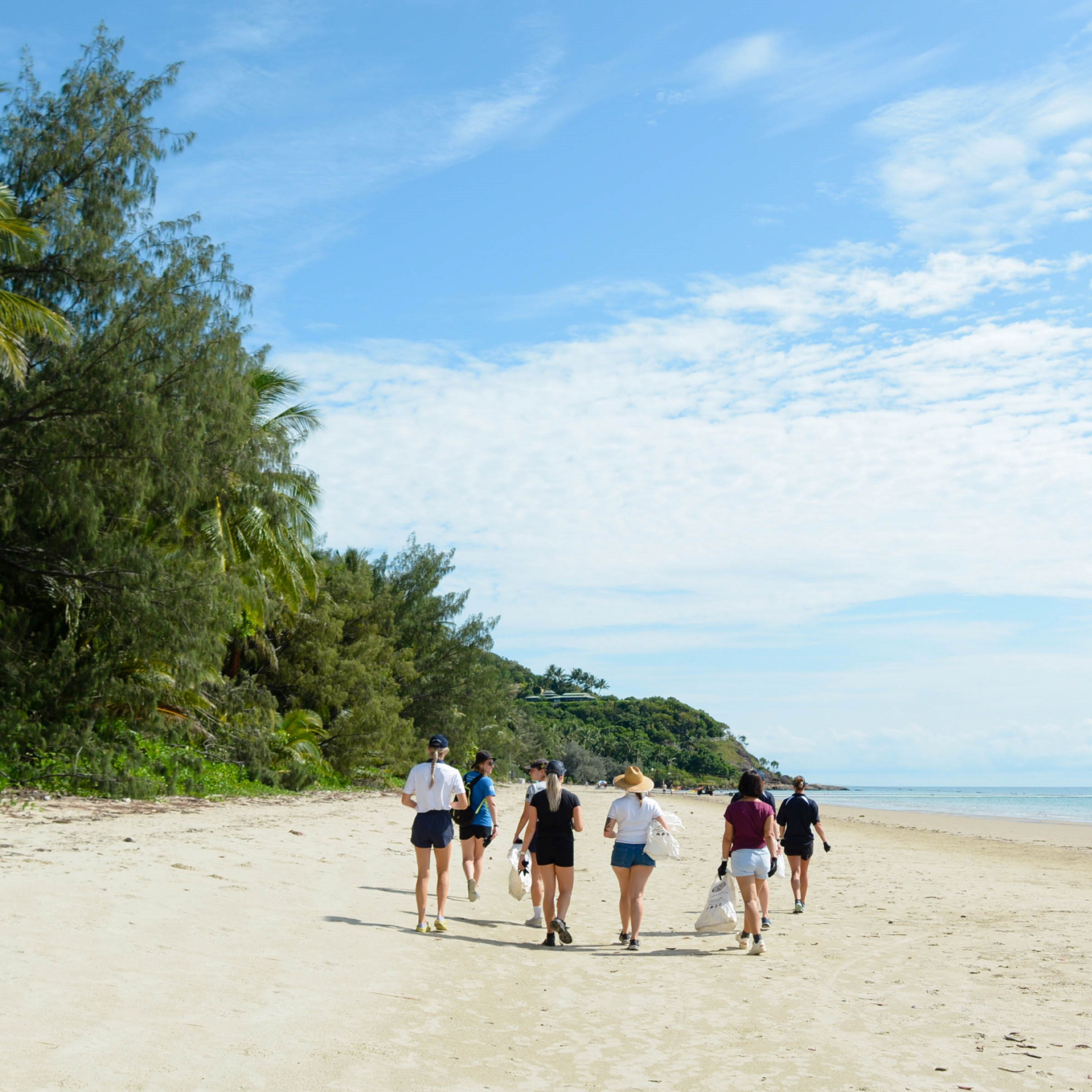 People walking on beach.