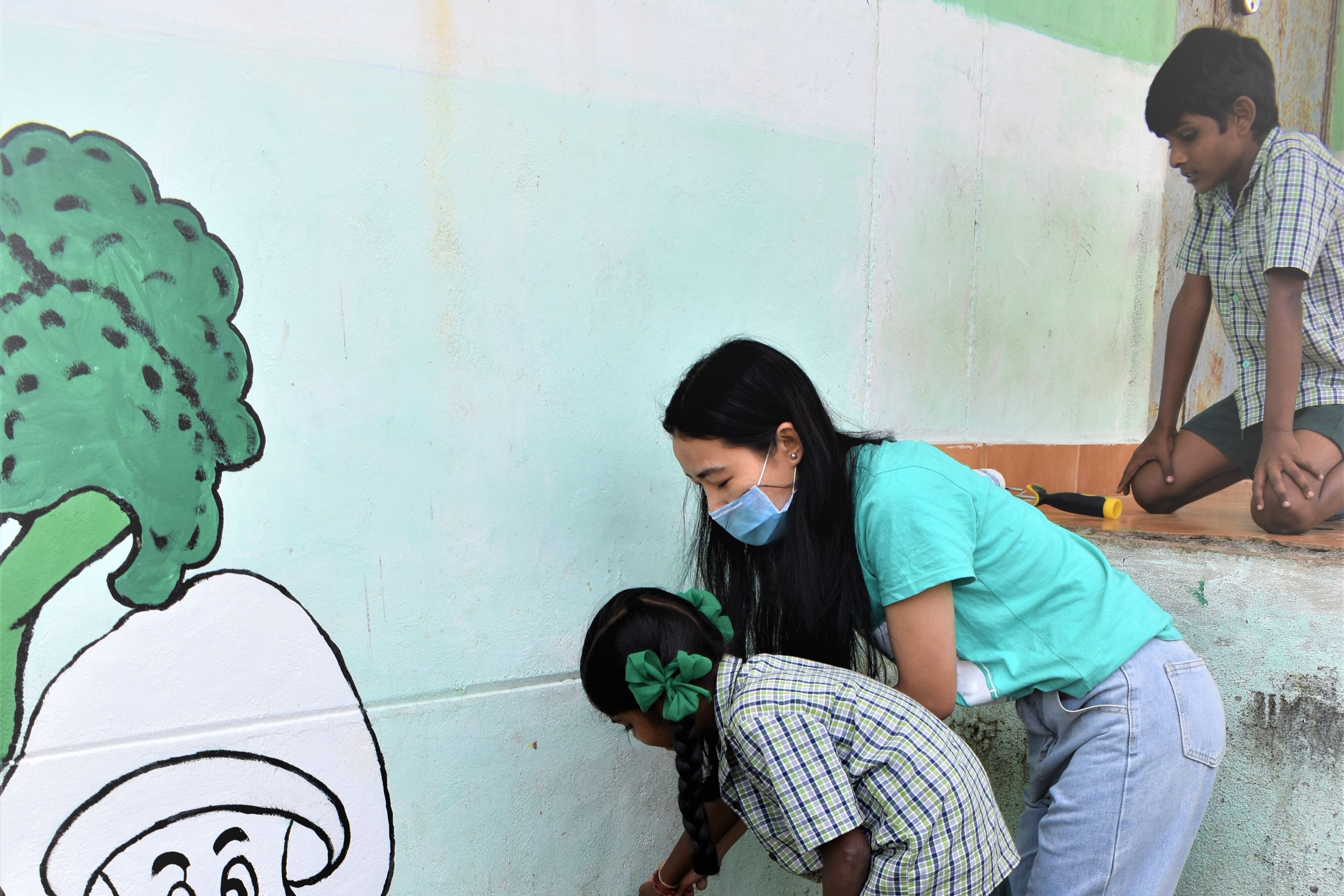 Associate Painting a Wall
