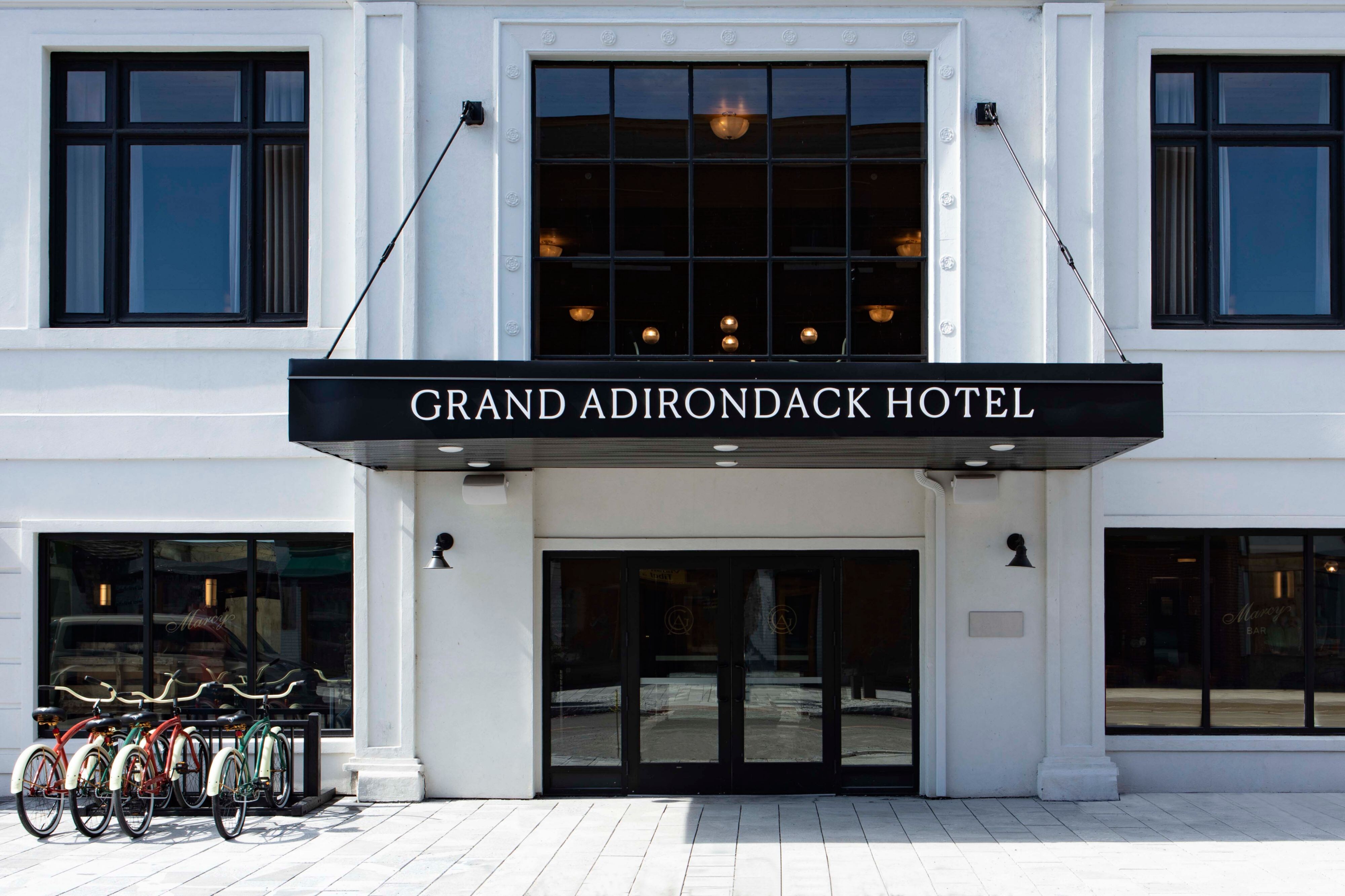Hotel entrance. There are bikes parked outside the hotel