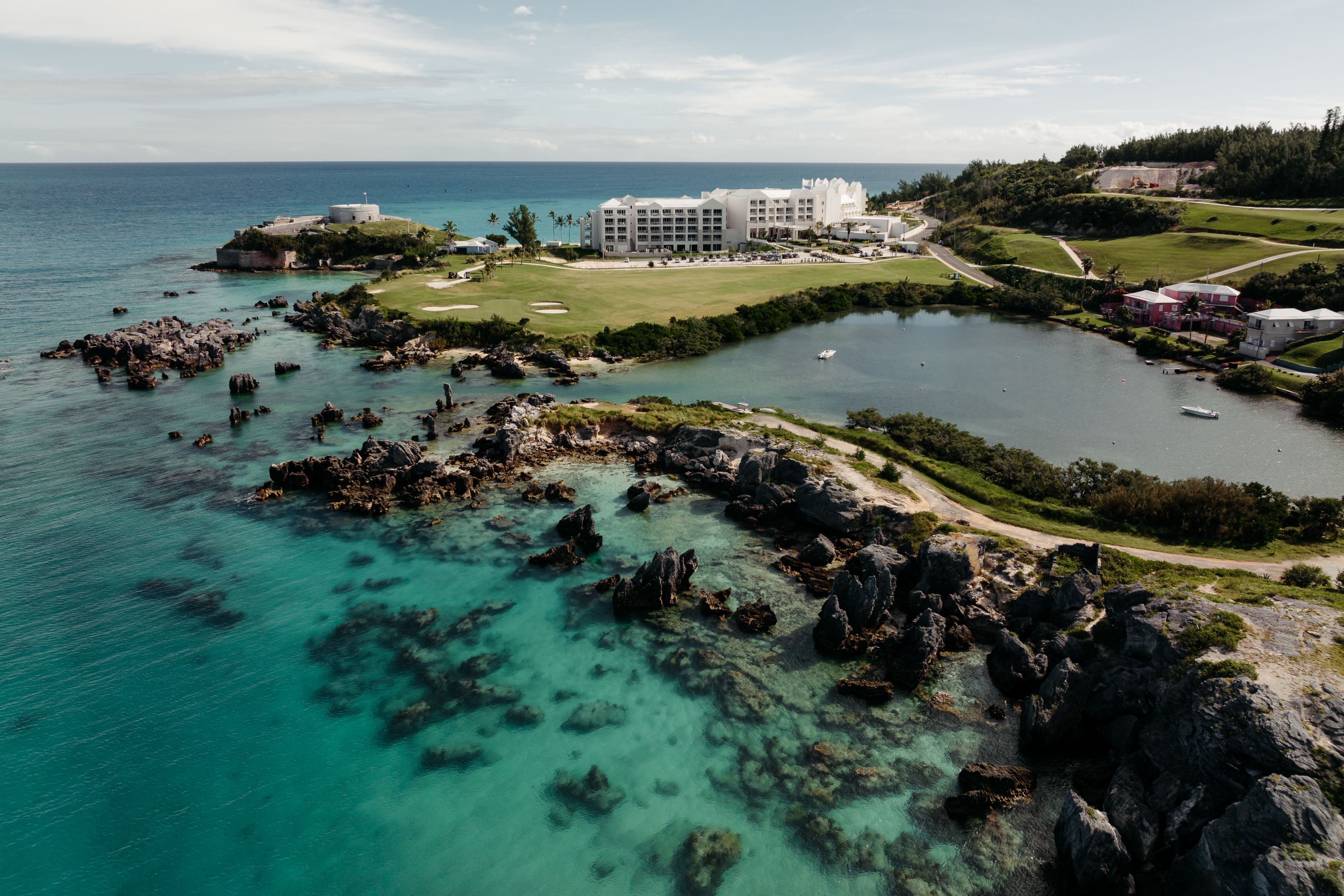 Hotel exterior and golf course near the sea